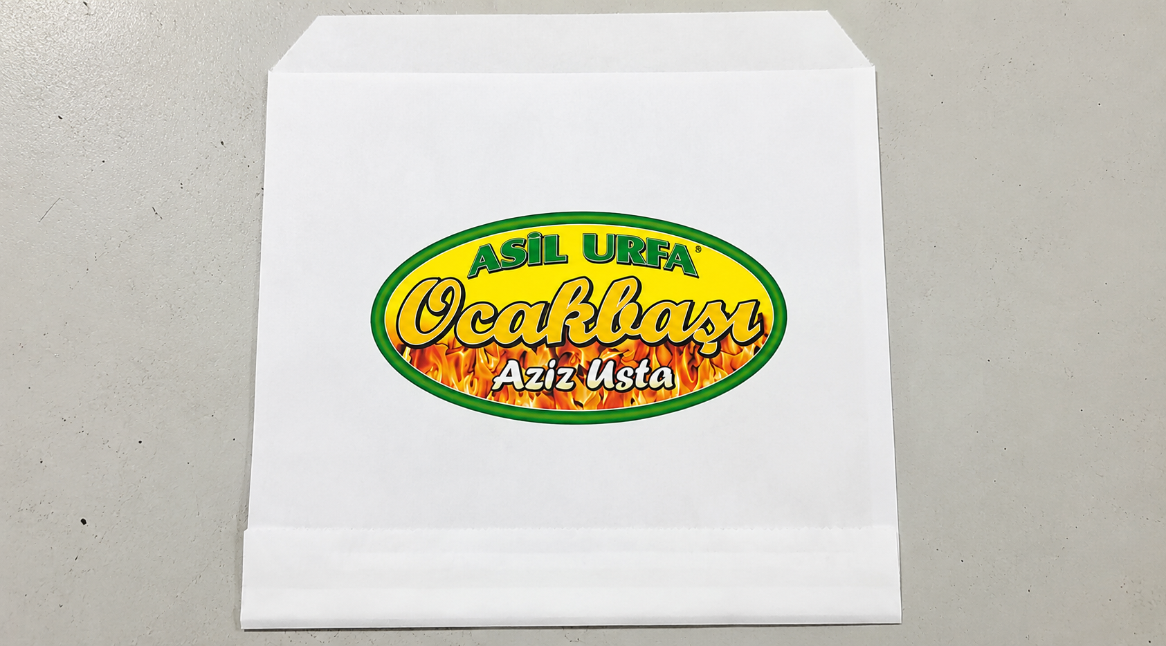 Asil Urfa Ocakbaşı — Weiße Papiertüte mit Logodruck